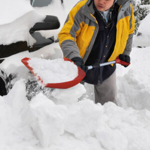 David Hom digs out the first of several cars covered with snow in front of his home on Sea Cliff Avenue in Sea Cliff, N.Y. after a blizzard hit the Long Island area overnight on Sunday, Dec. 20, 2009. A blizzard-like storm rocked the Mid-Atlantic and Northeast on Saturday, crippling travel across the region and causing hundreds of thousands of power outages. (AP Photo/Kathy Kmonicek)